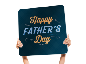 handheld sign with the text reading "Happy Father's Day"